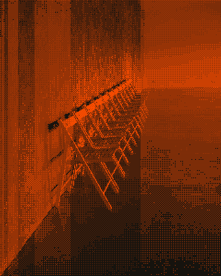 A row of folding chairs against a bare concrete wall, waiting to be set out
